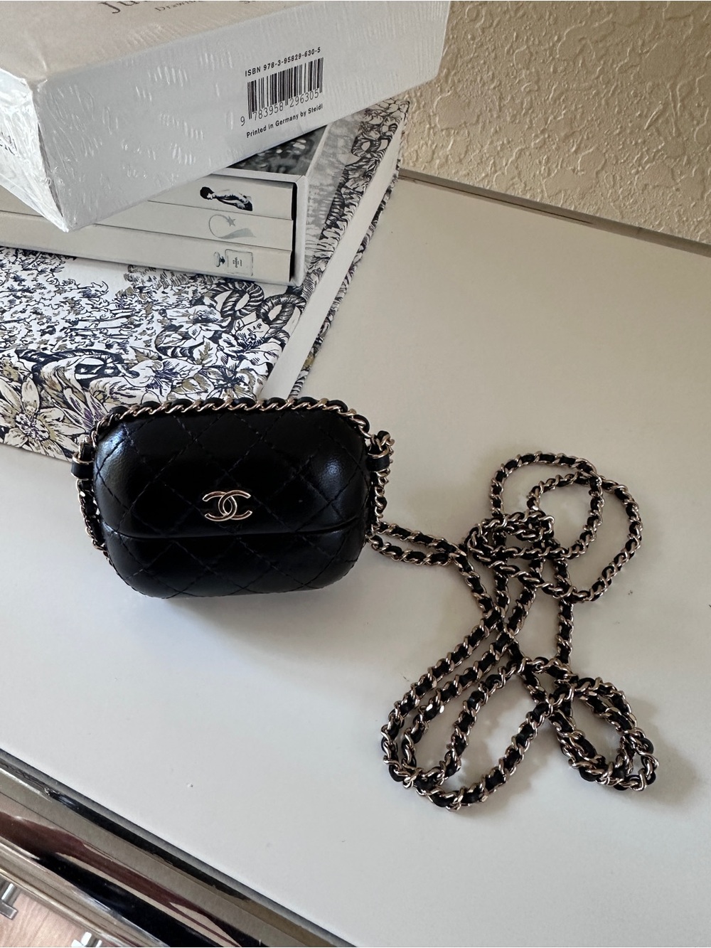 CHANEL Lambskin Quilted Chain Around Airpods Pro Case With Chain Black in Black.